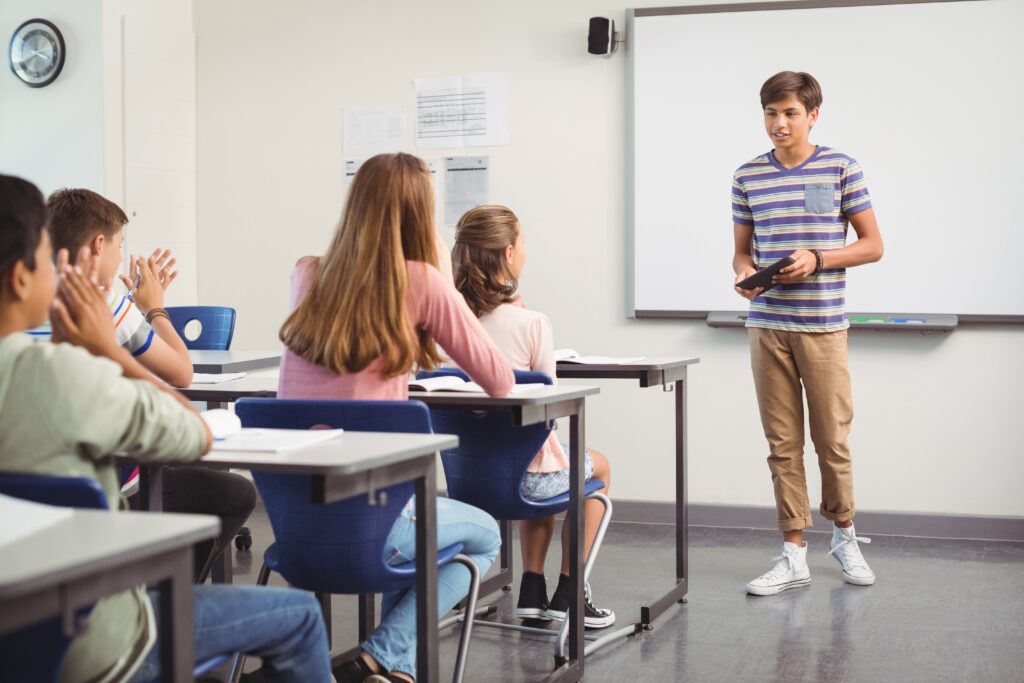 Child presenting to classmates.