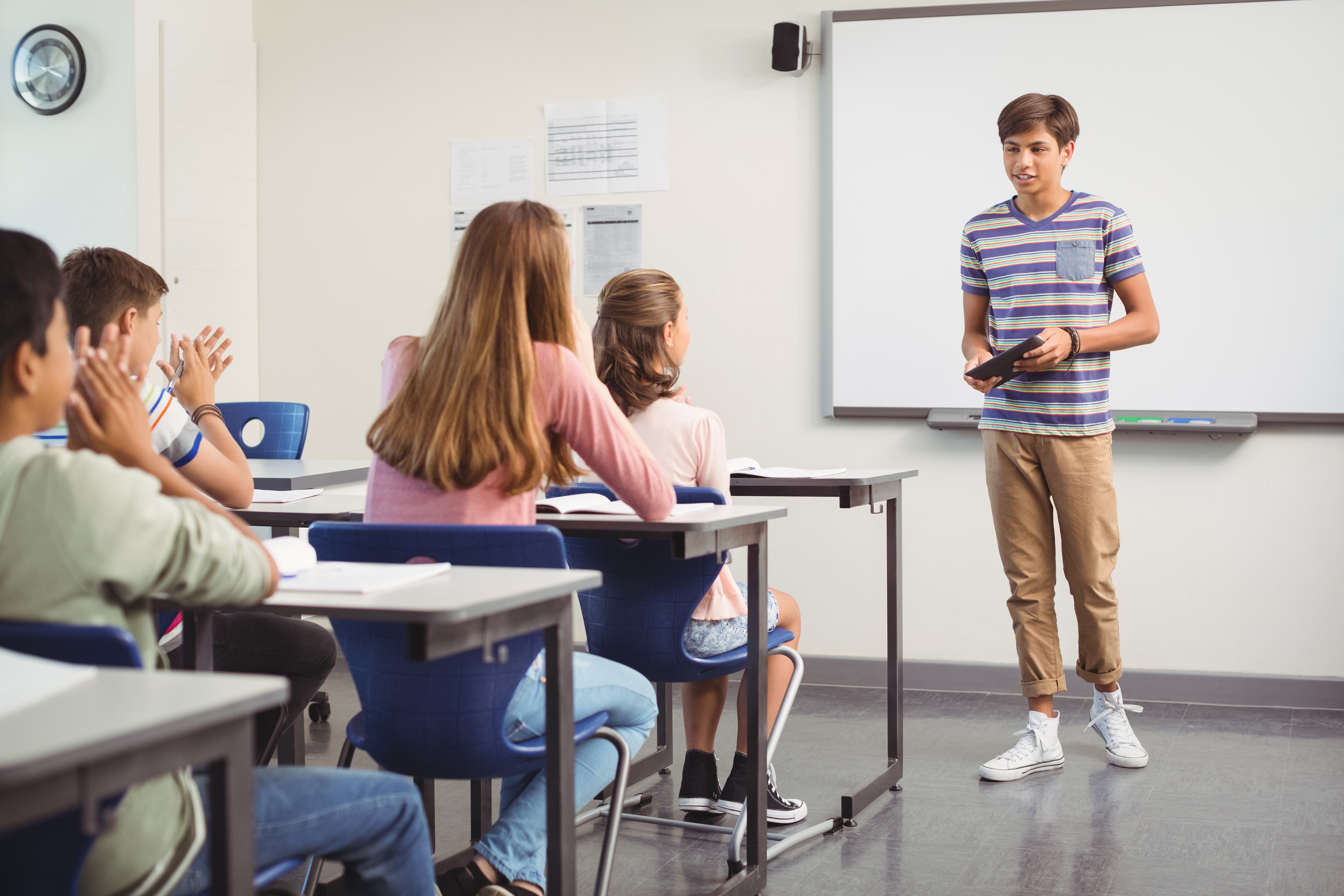 Schoolboy Giving Presentation In Classroom GradePower Learning